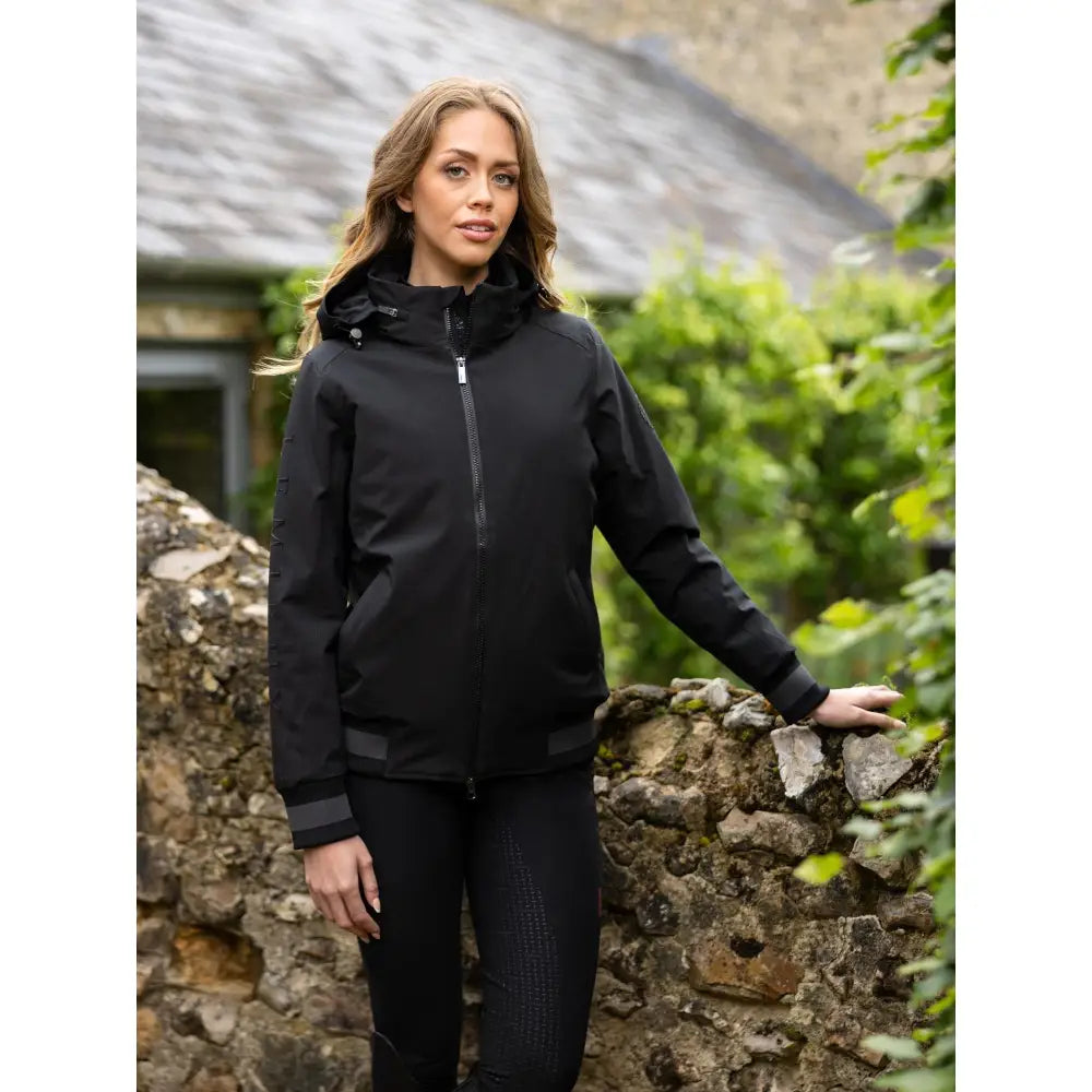 Black waterproof ladies team jacket with hood and zippered front perfect for outdoor riding and team activities