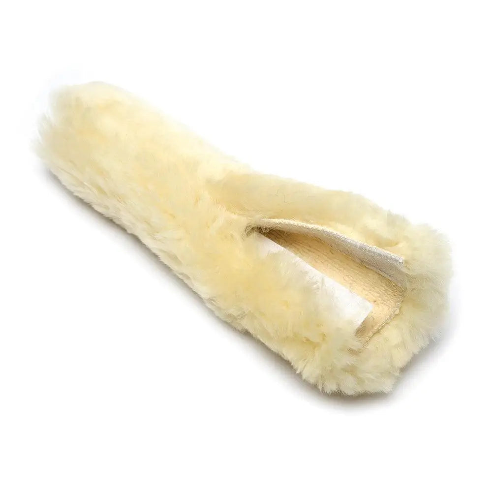 Cream-colored lambswool noseband cover with soft fluffy merino lambswool texture for french blinkers