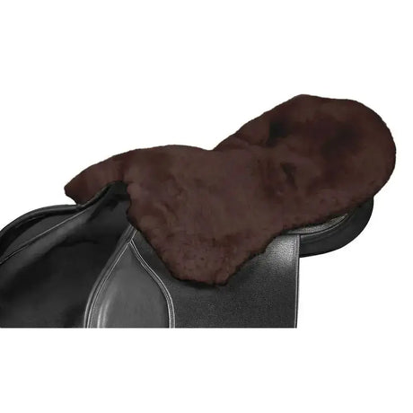 Brown lambswool seat saver mocha with soft plush texture and streamlined shaping on black leather horse saddle