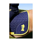 Navy blue quilted lancelot saddle pad with contrasting yellow stitching and stylized knight emblem by little knight