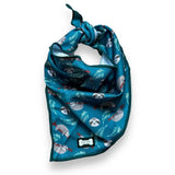 Teal lazy sloth cooling bandana with playful sloth and leaf pattern and pup chic brand tag for hot days