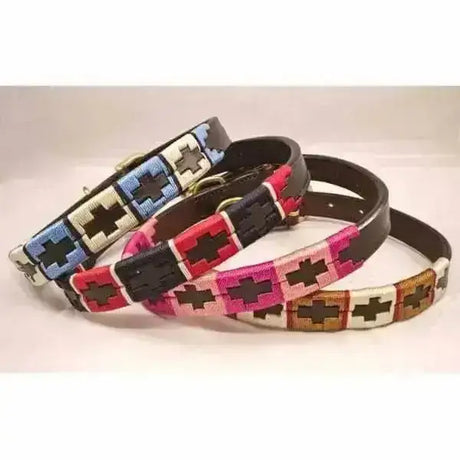 Four colorful cross patterned leather polo dog collars with embroidered designs in blue pink and brown for large dogs