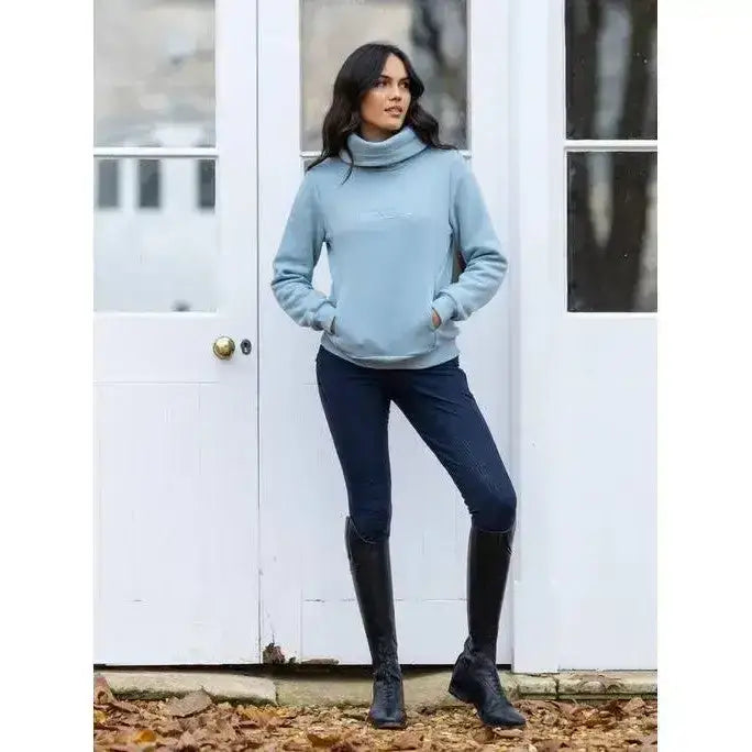 A soft light blue lemieux adele funnel neck sweat glacier with long sleeves and front pocket for cozy wear