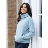 A soft light blue lemieux adele funnel neck sweat glacier with subtle embroidered logo on the chest