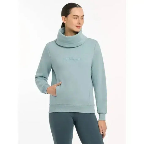Soft mint green lemieux adele funnel neck sweat with subtle embroidered logo across chest in neck sweat glacier style