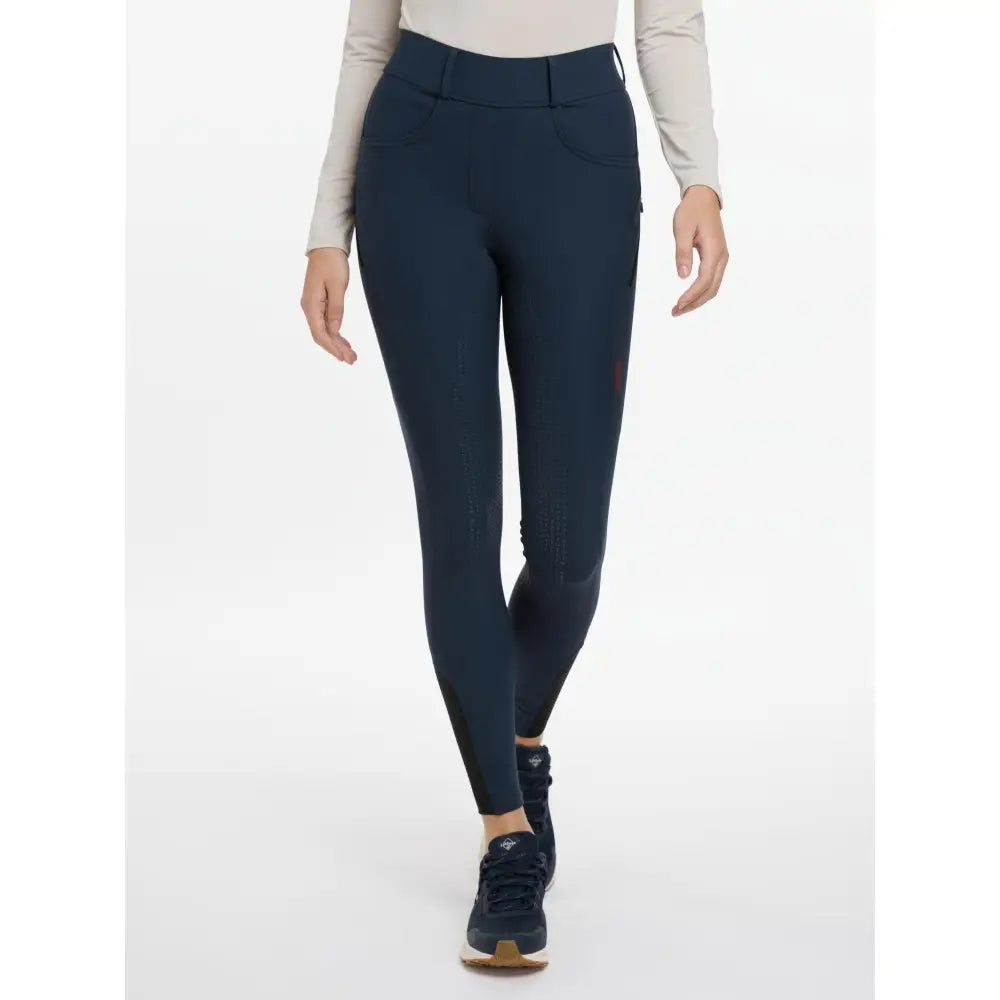 Navy blue high waisted riding leggings with sleek fit and side pockets lemieux amy breggings amy breggings navy