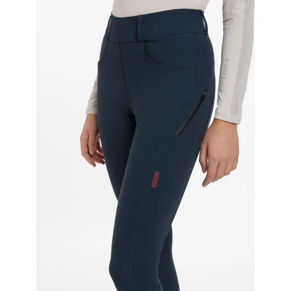 Navy blue lemieux amy breggings with high waist zippered pockets and red branding perfect for performance riding