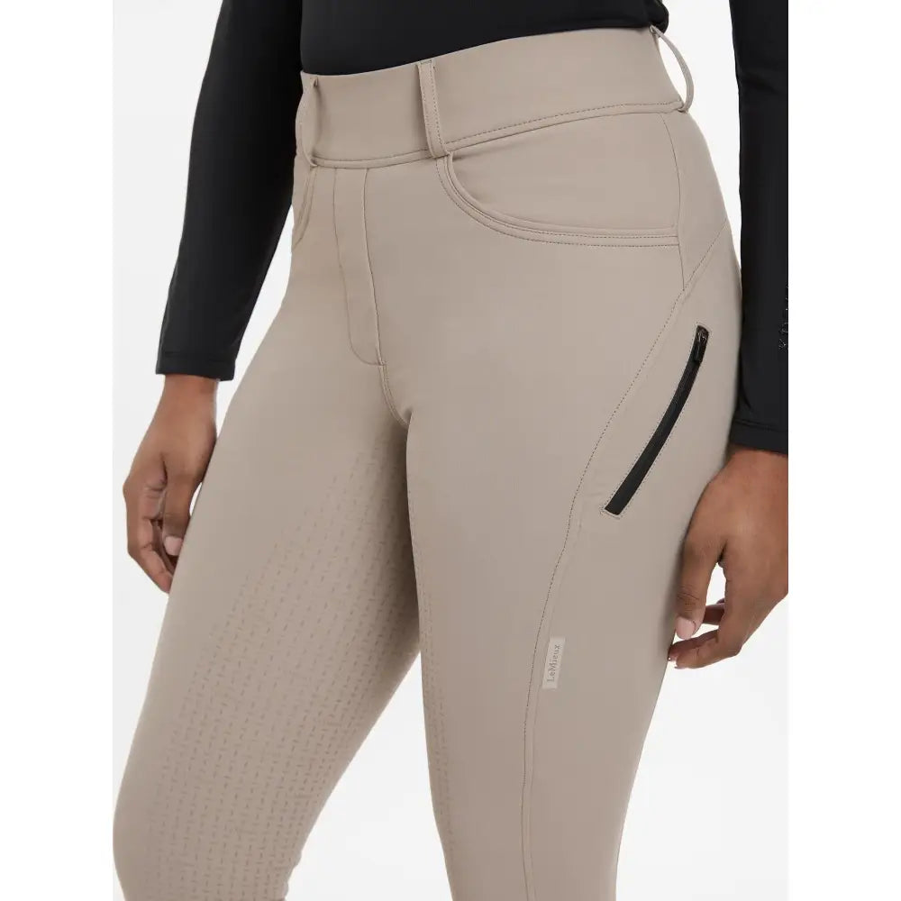 Beige lemieux amy breggings pecan riding pants with sleek form-fitting design and black zipper accents