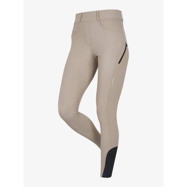 Beige lemieux amy breggings pecan with black lower leg accents and zippered side pocket for riding comfort