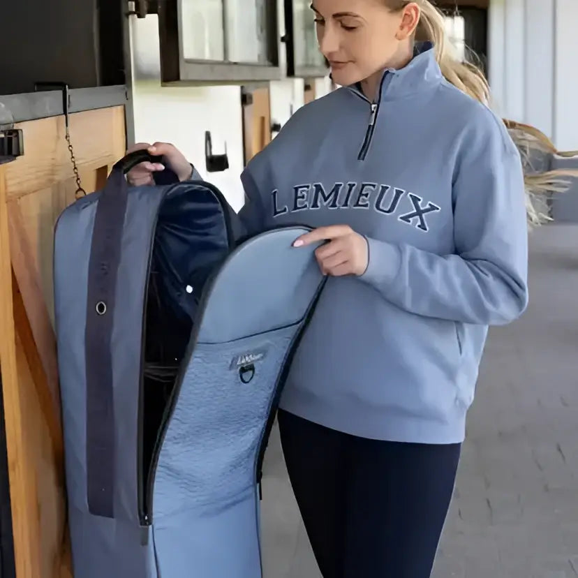 Blue textured lemieux anatomical bridle bag in powder blue with dark blue zipper made of waterproof nylon
