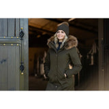 Woman in dark green Lemieux Anya Waterproof Riding Coat Alpine with fur-trimmed hood