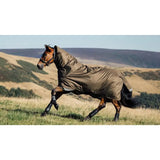 Horse wearing a full-body protective blanket galloping across a grassy field.