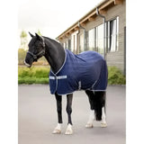 Navy blue lemieux arika air-tek sheet with white trim and brand logo patches designed for horse comfort
