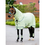 A light green lemieux arika armour-tek fly rug macaron with navy trim and breathable fabric for horse comfort