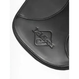 Black leather saddle pad with embossed lambskin logo and stitched edges paired with lemieux arika contoured stud girth black