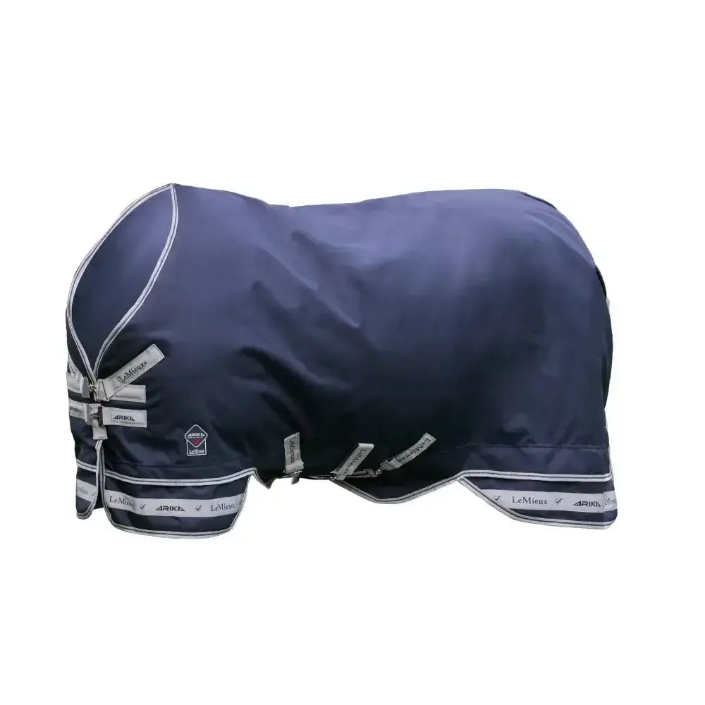Navy blue lemieux arika featherweight waterproof horse rug with silver trim and branded straps beta innovation gold