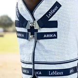 White and navy blue checkered lemieux arika field rug white with black straps and branding for outdoor use