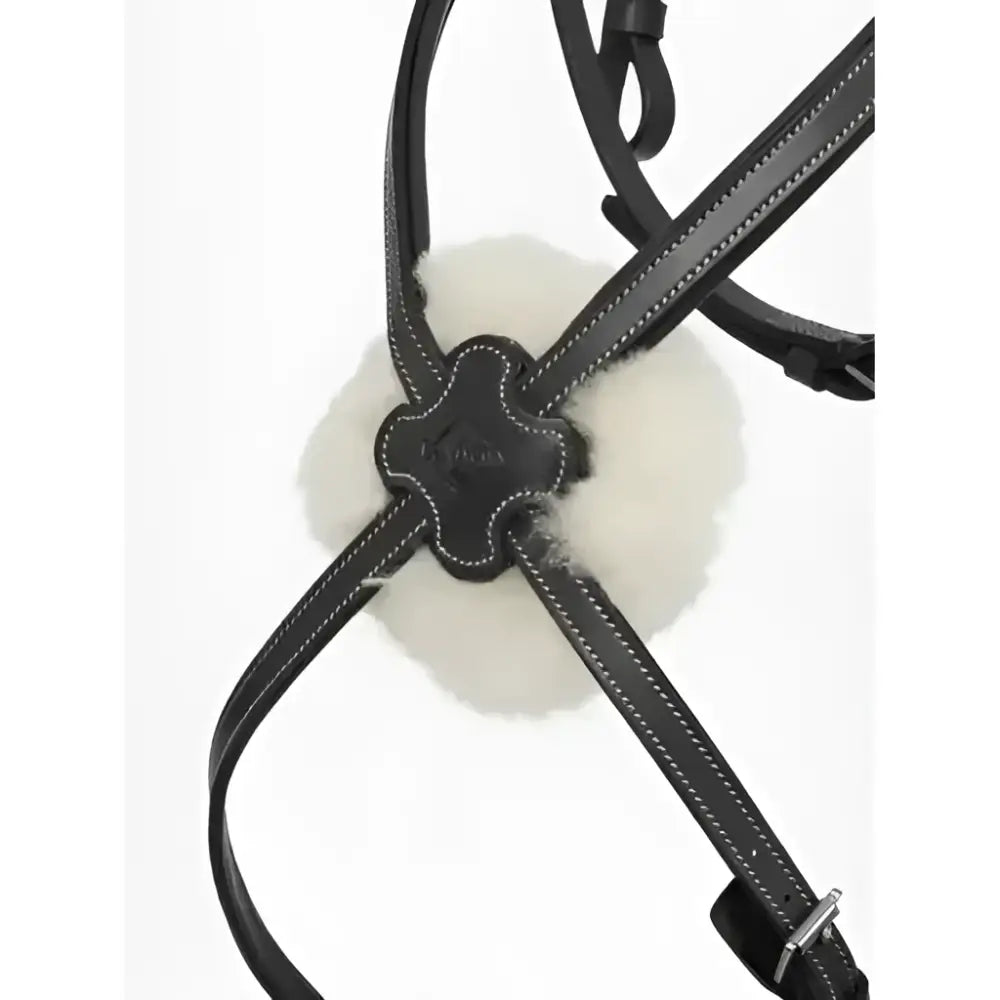 Black leather lemieux arika grackle bridle worn higher with a fluffy white fur accent at the central buckle