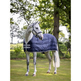 Navy blue quilted lemieux arika liner 100g horse blanket with white trim and brand logo patches for warmth and comfort