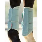 Light blue lemieux arika mesh brushing boots aqua with mesh panels and adjustable straps for horse leg protection