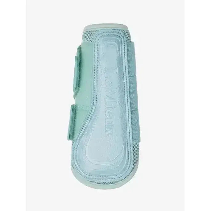 Light blue lemieux arika mesh brushing boots aqua with velcro straps and breathable mesh for hoof protection