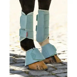 Light blue lemieux arika reach boots aqua with mesh panels and adjustable straps for horse leg protection