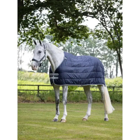Navy blue quilted lemieux arika rug liner 200g with silver trim and adjustable straps for horses
