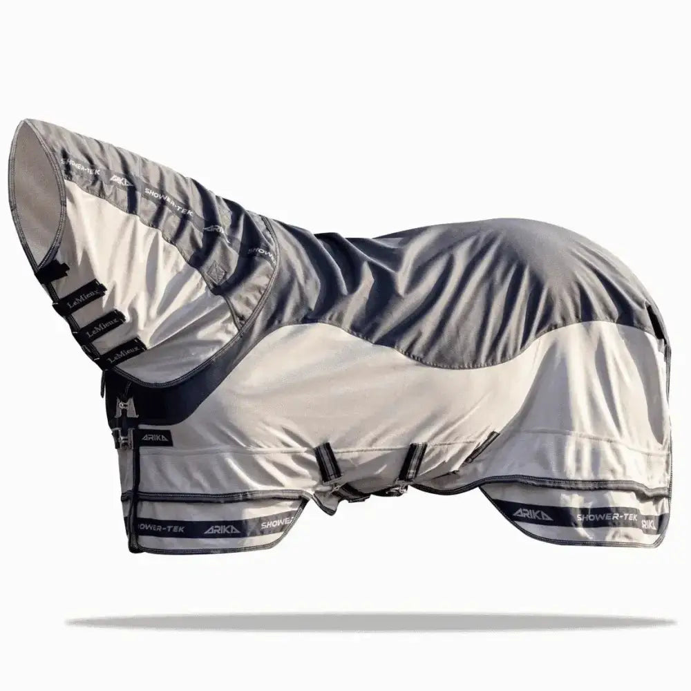 Gray and white lemieux arika shower-tek fly rug with black trim and adjustable straps for horse protection