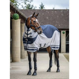A sleek navy and white lemieux arika shower-tek fly rug with black trim, reinforced stitching, and adjustable straps