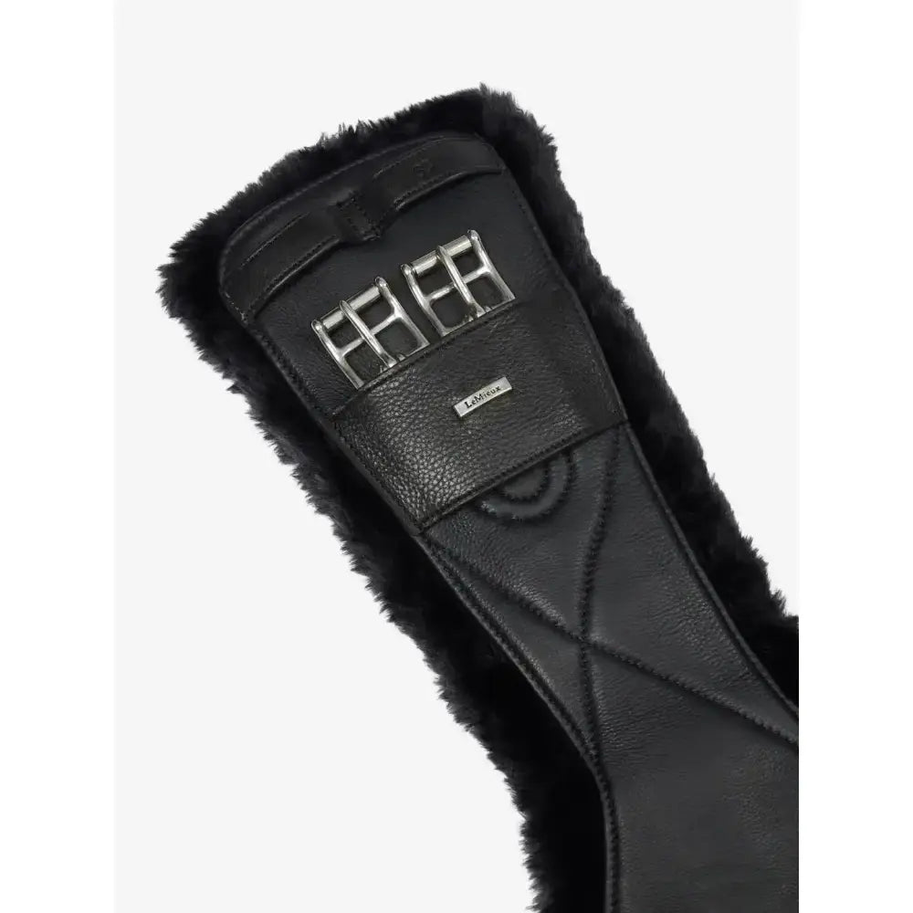 Black leather lemieux arika simuwool contoured dressage girth with plush fur trim and silver metal buckles