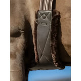 Brown leather lemieux arika simuwool saddle pad with plush fur trim and striped strap simuwool contoured long girth