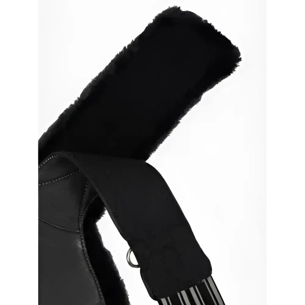 Black leather strap contoured long stud girth with plush arika simuwool lining and metal hardware by lemieux arika