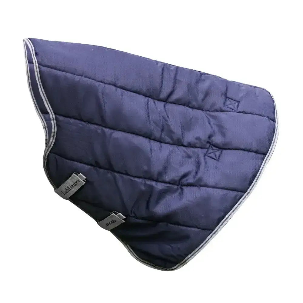 Navy blue quilted lemieux arika stable-tek 100g saddle pad with silver trim and diamond ripstop outer fabric