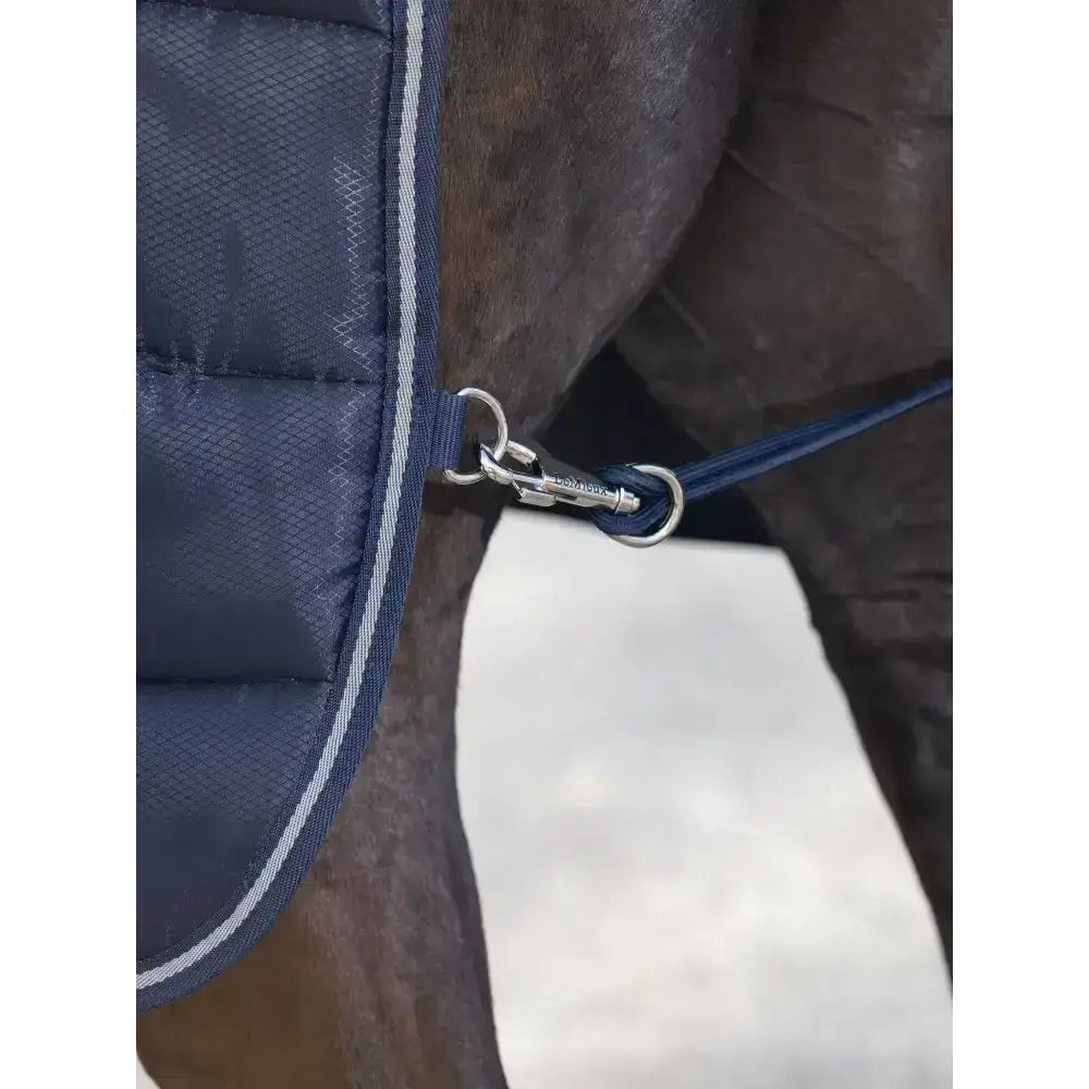 Navy blue quilted lemieux arika stable-tek 200g horse blanket with silver trim and diamond ripstop outer with metal clip