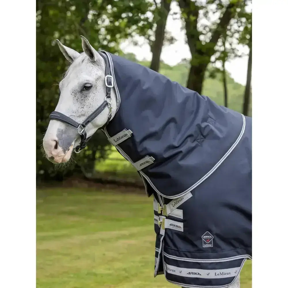 Navy blue waterproof lemieux arika storm-tek neck cover 100g with white trim and silver buckles for turnouts