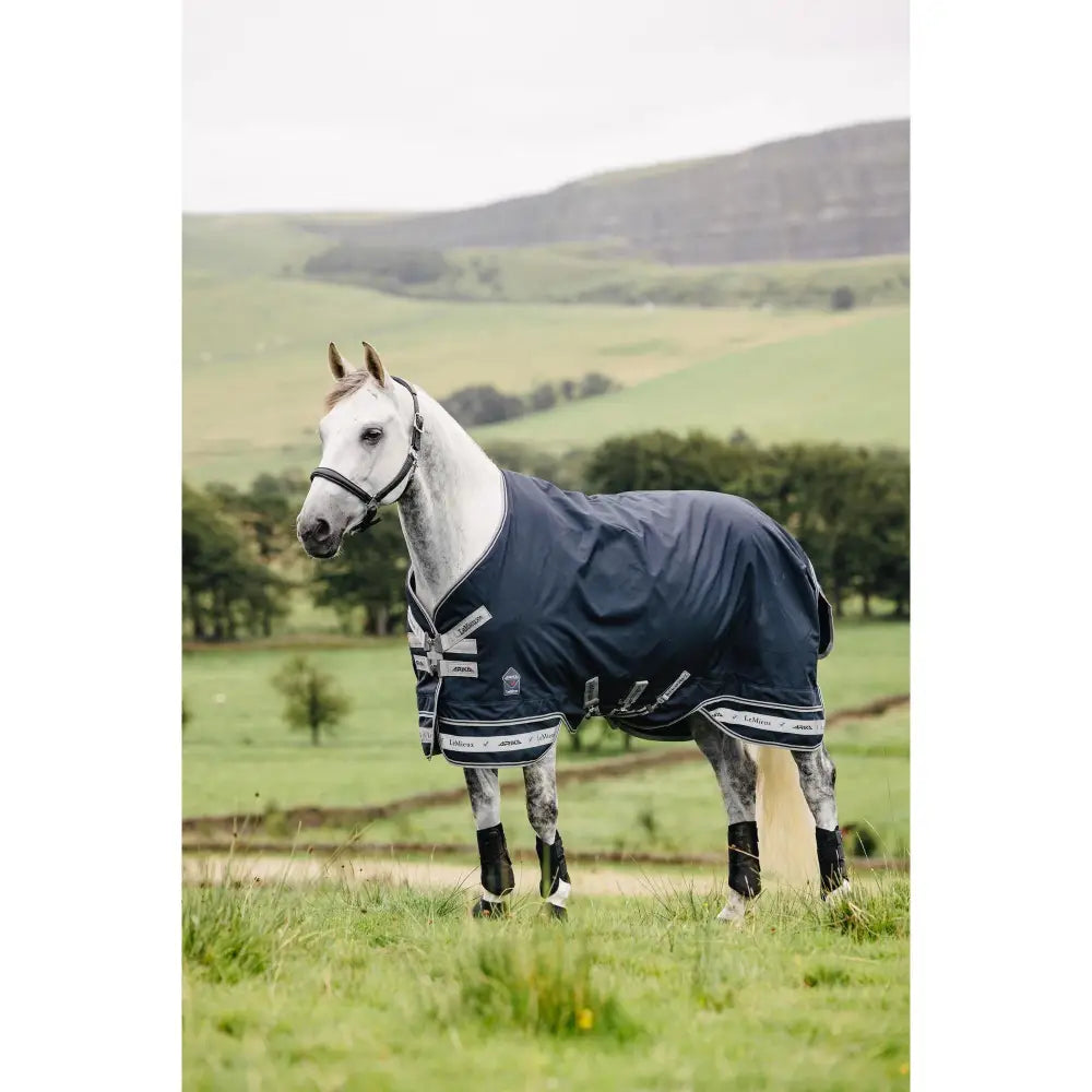 Navy blue lemieux arika storm-tek rug with white trim and logos 100g material arika storm-tek turnout innovation gold award