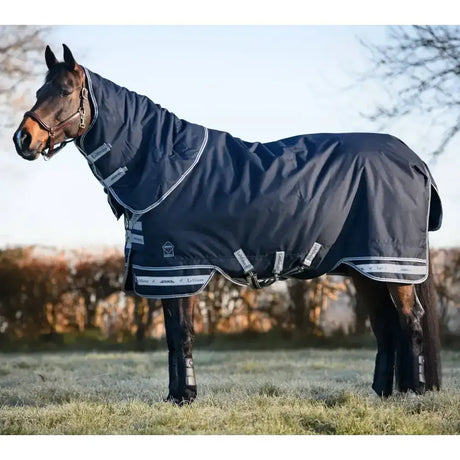 Navy blue lemieux arika storm-tek rug with white trim and reflective stripes for horse protection and warmth