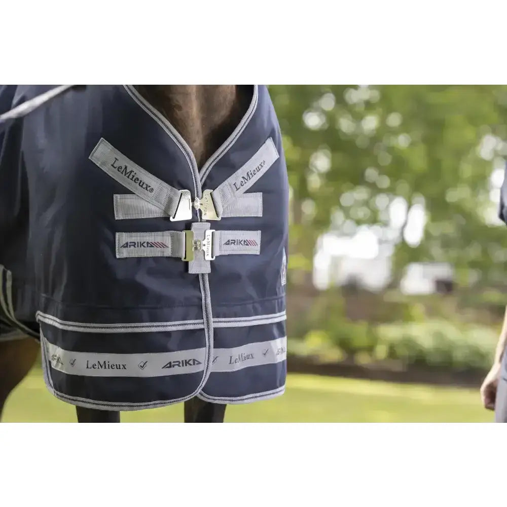 Navy lemieux arika storm-tek horse blanket with silver reflective trim and branded beta innovation gold straps