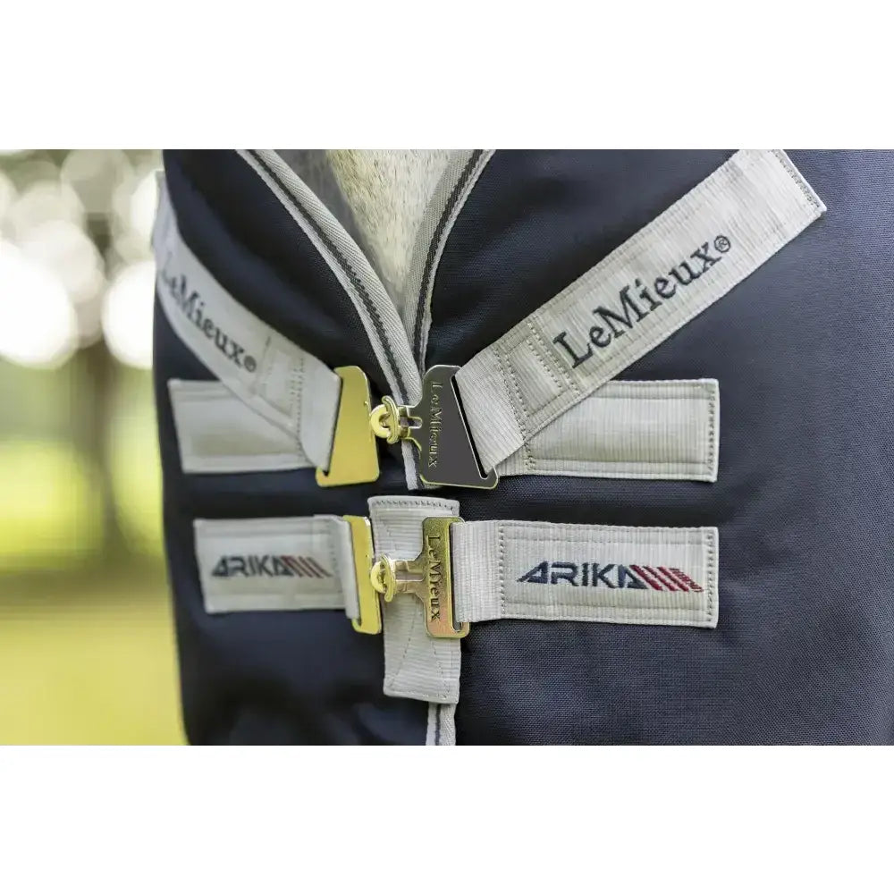 Navy blue lemieux arika storm-tek rug 50g with white straps and gold beta innovation gold buckles