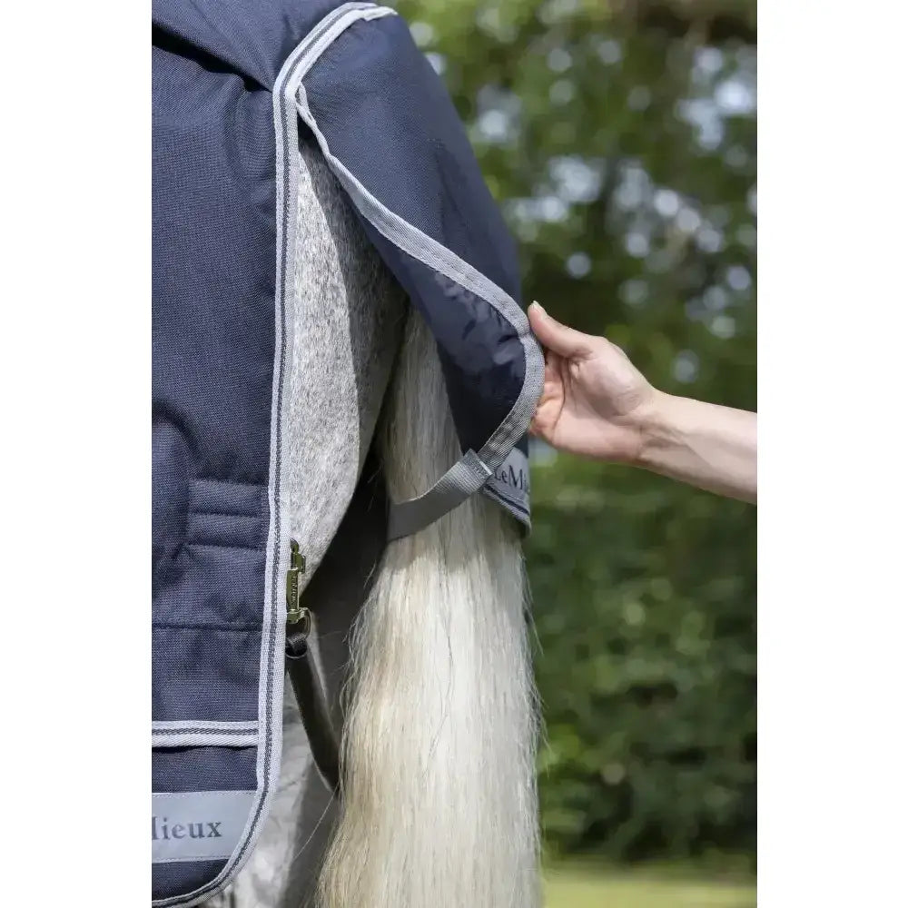 Navy blue lemieux arika storm-tek quilted horse blanket with gray fleece lining and silver trim beta innovation gold