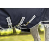 Dark navy blue lemieux arika storm-tek rug 50g with white trim gold-toned beta innovation gold hardware and branded tags