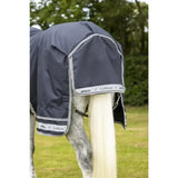 Dark gray lemieux arika storm-tek waterproof horse blanket with white trim and beta innovation gold branding