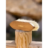 A light brown wooden lemieux artisan deep clean dandy brush with soft off-white bristles for deep grooming