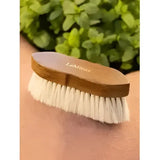 A light brown wooden lemieux artisan soft finishing brush with white anti-static bristle finishing for smooth grooming