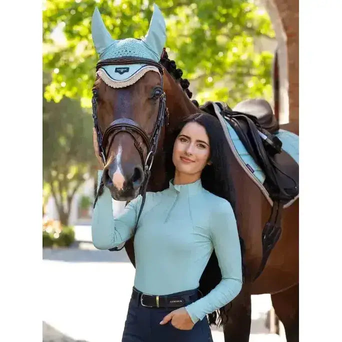 Light blue lemieux base layer aqua long-sleeved top with high collar and subtle ribbed texture for riding