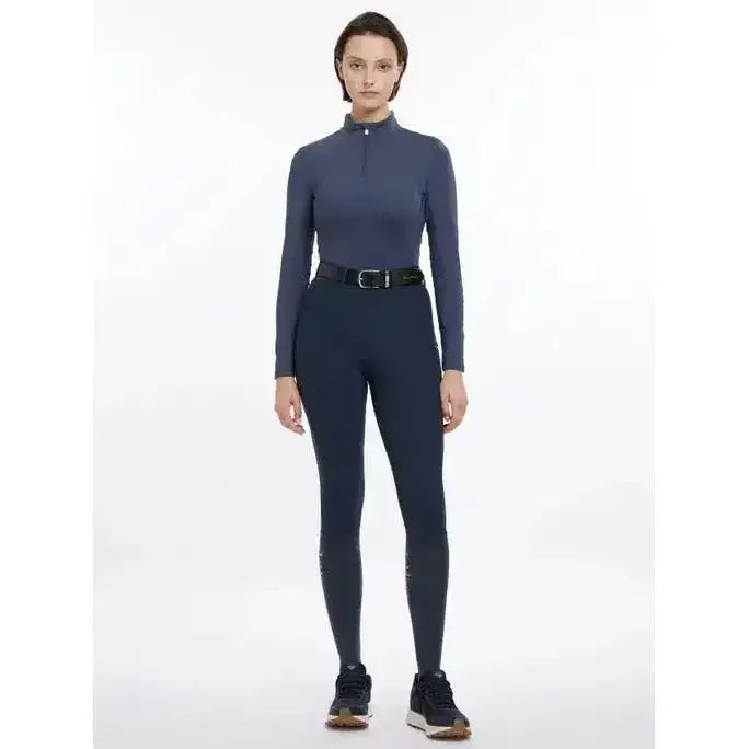 Dark blue lemieux base layer long-sleeved top with high collar and zipper paired with matching base layer dusk leggings