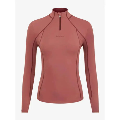 Women’s lemieux base layer orchid long-sleeve quarter-zip top in soft rose terracotta with dark stitching for unrestricted comfort