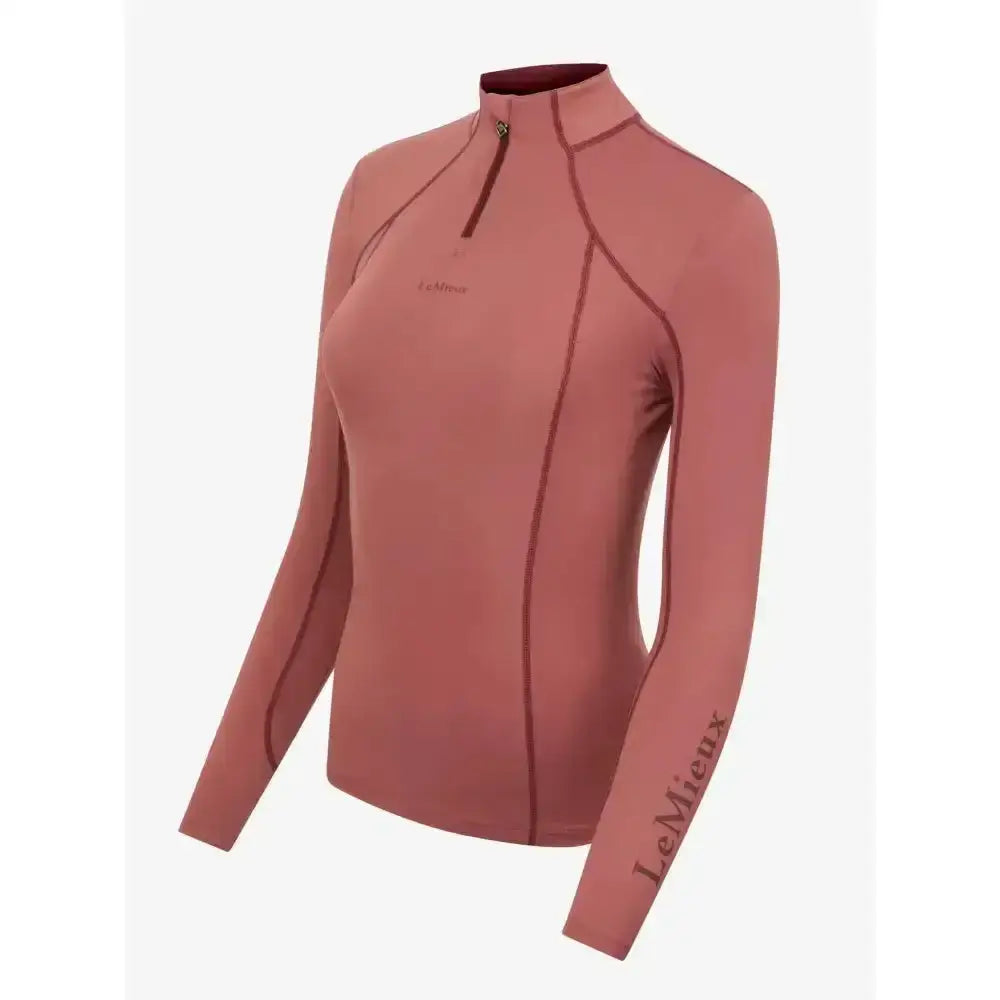 A dusty rose lemieux base layer orchid with a high collar and subtle seam detailing for unrestricted comfort