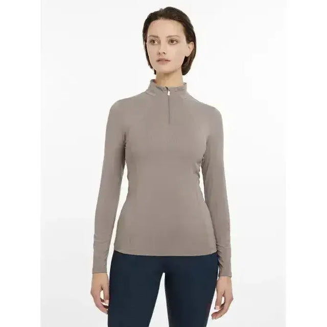 A sleek taupe lemieux base layer pecan with long sleeves, high collar, and front zipper for athletic wear