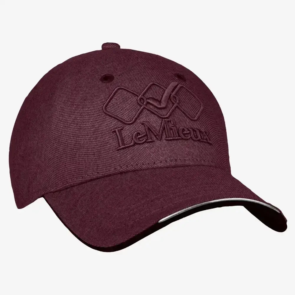 Maroon textured fabric lemieux baseball cap with embroidered logo and black trim featuring a unique seamless shell design